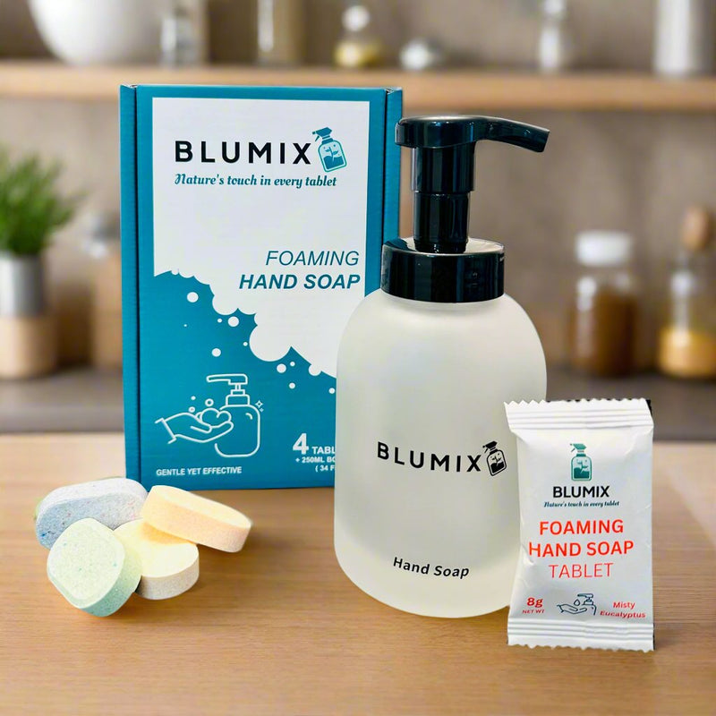 Frosted glass hand soap dispenser with black pump and four uniquely scented foaming hand soap tablets